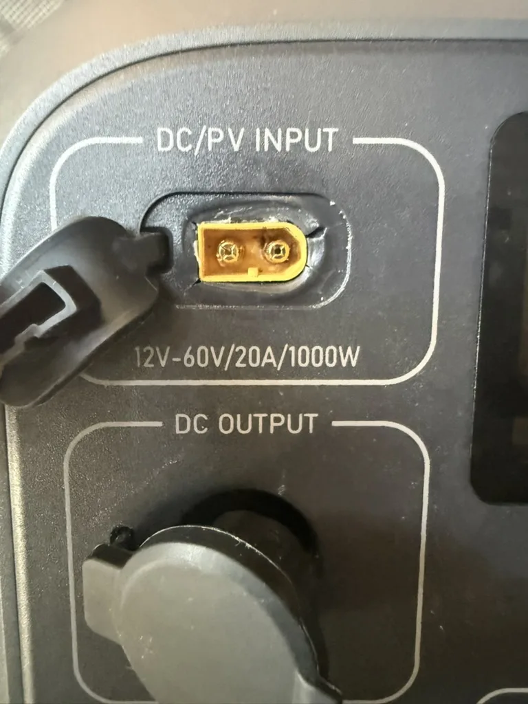 The DC/PV input port on the power station with a cord seated in it
